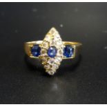 EDWARDIAN SAPPHIRE AND DIAMOND DRESS RING the central oval cut sapphire in marquise shaped diamond