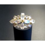 MOONSTONE CLUSTER RING the pear and round cut moonstones in pierced setting, on nine carat gold
