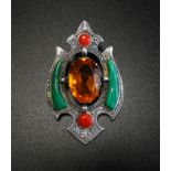 SILVER AND STONE SET BROOCH the central oval cut Cairngorm with malachite and carnelian set surround