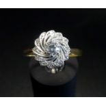 ATTRACTIVE DIAMOND RING the central round brilliant cut diamond approximately 0.3cts in swirl effect