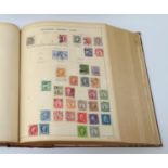 STAMP ALBUM circa 1900, containing a selection of late 19th/early 20th century World stamps