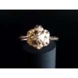 RUSSIAN FOURTEEN CARAT ROSE GOLD RING with central stylised crown, ring size Q-R and approximately