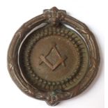MASONIC BRASS DOOR KNOCKER with a circular banded handle, the circular knocker back plate with the