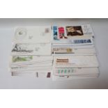 COLLECTION OF FIRST DAY COVERS dating from 1968 to 2001, approximately 67, together with a £5 book