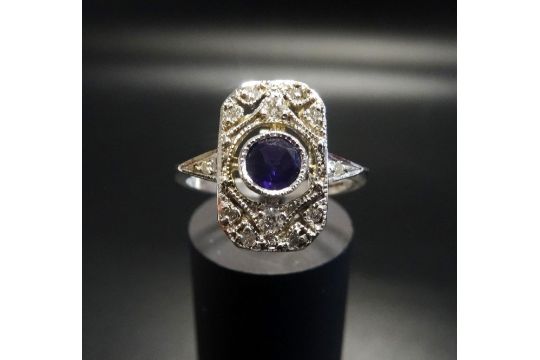 ART DECO STYLE AMETHYST AND DIAMOND PLAQUE RING the central round cut amethyst in pierced deiamond