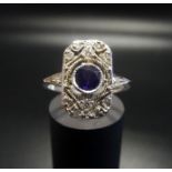 ART DECO STYLE AMETHYST AND DIAMOND PLAQUE RING the central round cut amethyst in pierced deiamond