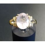 ROSE QUARTZ DRESS RING the oval cut quartz on nine carat gold shank with decorative pierced