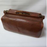 VINTAGE LEATHER GLADSTONE STYLE BAG with fitted linen interior, on stud feet, 51cm wide