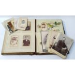 VICTORIAN FAMILY PHOTOGRAPH ALBUM containing a selection of images by various studios, in