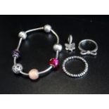 SELECTION OF PANDORA JEWELLERY comprising a silver Essence charm bracelet with six Essence charms (