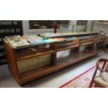 LARGE 1950s TEAK AND GLAZED DISPLAY CABINET in four combined sections, with upper shelving areas