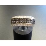 BLACK AND WHITE DIAMOND CLUSTER RING the double row of black diamonds with a row of white diamonds