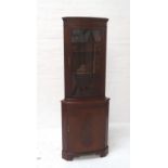 MAHOGANY CORNER CABINET with glazed upper section on cupboard base, both sections with shelved