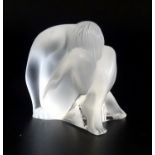 LALIQUE FROSTED GLASS FIGURINE of a nude maiden with her head resting on her crossed legs, signed to