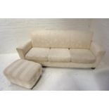 LARGE THREE SEAT SOFA covered in a cream floral material, standing on stout supports, 226cm long,