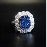 IMPRESSIVE SAPPHIRE AND DIAMOND CLUSTER DRESS RING the central cluster of princess cut sapphires