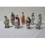 EIGHT CHINESE FIGURINES each in traditional dress (8)