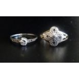TWO DIAMOND SET RINGS one a solitaire ring of approximately 0.25cts, with further small diamonds