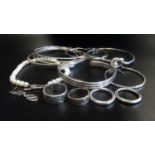 SELECTION OF SILVER JEWELLERY comprising three bangles of various designs, a pearl bracelet with