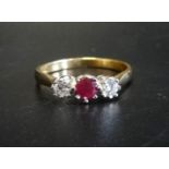 RUBY AND DIAMOND THREE STONE RING the central ruby approximately 0.25cts flanked by diamonds