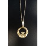 NINE CARAT GOLD CLADDAGH PENDANT on nine carat gold chain, total weight approximately 7.3 grams