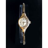 LADIES ROTARY NINE CARAT GOLD WRISTWATCH the dial with Arabic numerals at 3, 6, 9 and 12 and baton