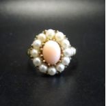 CORAL AND SEED PEARL CLUSTER RING on nine carat gold shank, ring size O-P
