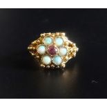 OPAL AND PINK GEM SET CLUSTER RING the central pink gemstone in six opal surround, on nine carat