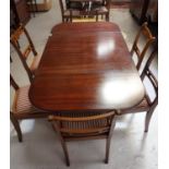 GEORGIAN STYLE MAHOGANY AND CROSSBANDED DINING TABLE with shaped drop flaps, standing on a turned