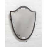 GEORGE III STYLE WALNUT FRET CARVED WALL MIRROR with an oblong plate, 61cm high, together with a