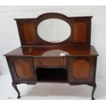 MAHOGANY BREAKFRONT SIDEBOARD the shaped raised back centred with an oval bevelled mirror, flanked