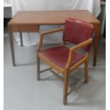 1950s OAK OFFICE DESK with an inset top above two frieze drawers, standing on tapering supports,