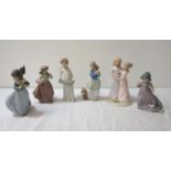 FIVE NAO PORCELAIN FIGURINES including a young girl holding a cake with a dog beside her, 18.5cm