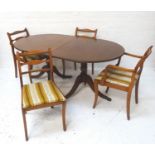 REGENCY STYLE MAHOGANY AND CROSSBANDED DINING TABLE with a pair of D ends and an extra leaf,