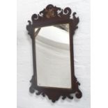 GEORGE III STYLE MAHOGANY FRET CARVED WALL MIRROR surmounted with a giltwood griffen, 88cm high