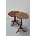 MAHOGANY WINE TABLE with a circular quarter veneered top on a turned column with four outswept