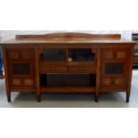 EDWARDIAN OAK SIDE CABINET with a replaced shaped and raised back above a moulded top with a pair of