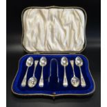 SET OF GEORGE V SILVER TEA SPOONS and a pair of sugar tongs, cased, london 1913