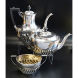 EDWARD VII SILVER TEA SET comprising a tea pot, hot water pot and a twin handled sugar bowl, all