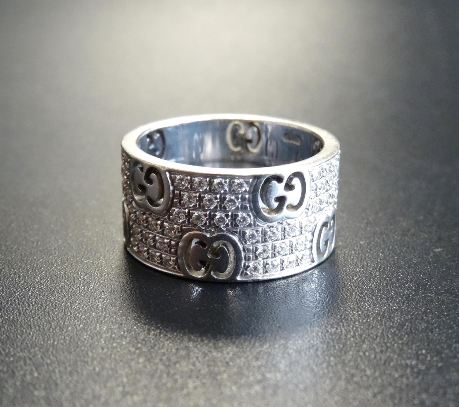 GUCCI ICON STARDUST WIDE BAND RING in eighteen carat white gold with pave set diamonds totalling