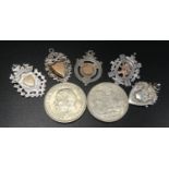 FIVE SILVER MEDAL FOBS four with gold detail, one with Gaelic inscription dated 1939 to reverse, and
