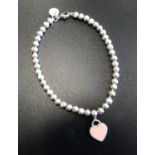 TIFFANY & CO. MINI HEART TAG SILVER BEAD BRACELET the heart tag with 'Return to Tiffany' engraving