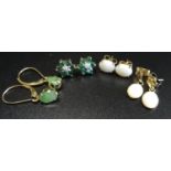 FOUR PAIRS OF GEM SET EARRINGS comprising a pair of emerald and diamond cluster stud earrings in ten