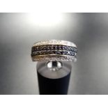 PAVE SET BLACK AND WHITE DIAMOND HALF ETERNITY RING the two rows of black diamonds with a row of