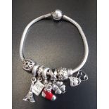 PANDORA MOMENTS SMOOTH SILVER CLASP BRACELET with six Pandora charms including a Christmas