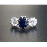 EXCEPTIONAL SAPPHIRE AND DIAMOND THREE STONE RING the central oval cut sapphire approximately 1.