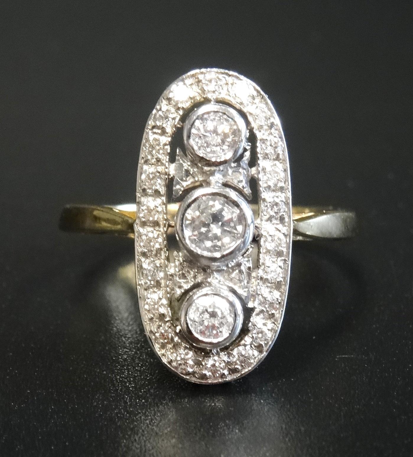 IMPRESSIVE ART DECO STYLE DIAMOND PLAQUE RING the diamonds in pierced oval setting totalling