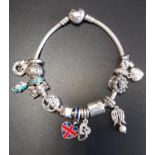 PANDORA MOMENTS SILVER HEART CLASP CHARM BRACELET with thirteen Pandora charms including an