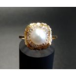 PEARL AND CZ CLUSTER DRESS RING the central pearl in CZ surround, in eighteen carat gold, ring
