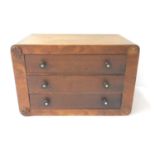 SMALL OAK TABLE TOP CHEST with three drawers with ebony turned handles inset with mother of pearl,